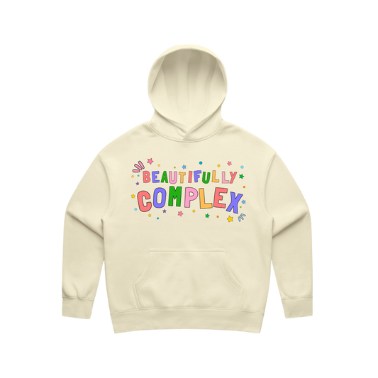 Beige hoodie with 'Beautifully Complex' text on a white background